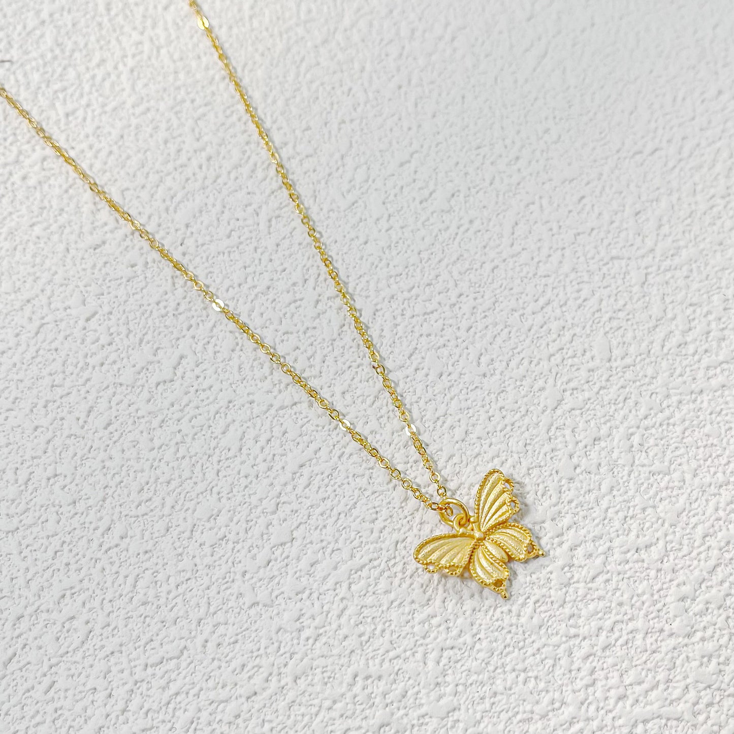 Golden Flutter – Filigree Butterfly Necklace