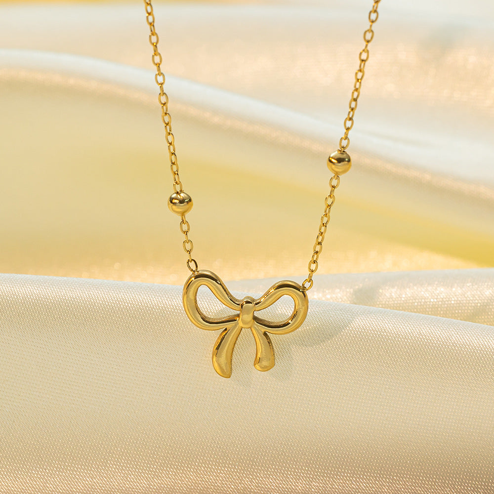 Golden Grace – Bow Pendant Necklace