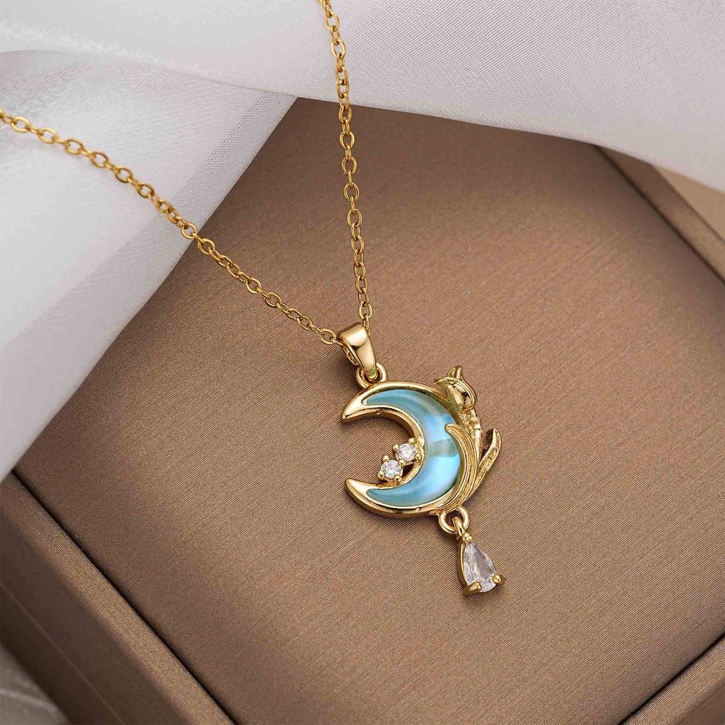 Celestial Glow – Light Blue Moon Pendant Necklace