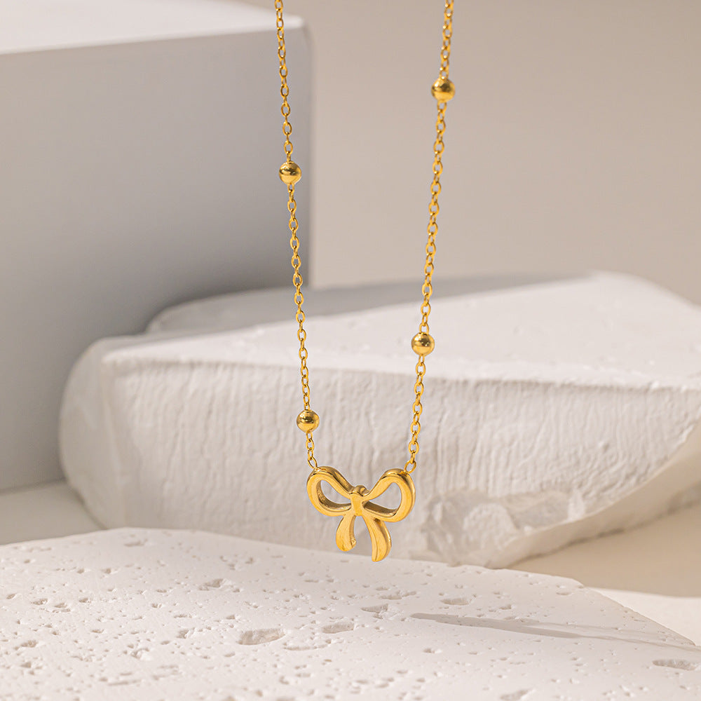 Golden Grace – Bow Pendant Necklace